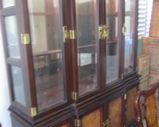 Classic Asian-Style China/Display Cabinet.  Many Beautiful Details:  Brass Hardware, Lighted, Silverware Drawer, Plate Grooves, Inlayed Burl Panels, Etched & Beveled Glass Doors.  (2-Pieces)  64" X 18" X 84" high