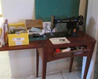 Older Singer Sewing Machine #221K, in Cabinet with Accessories and Cutting Mat.