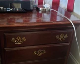 End table with gold handles. Solid wood, has some wear $10