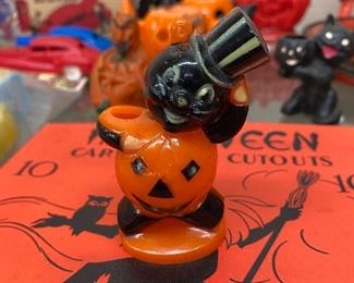 Halloween Cat Holding Pumpkin