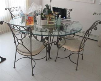 Beautiful Wrought Iron Glass Top Table With Four Chairs

