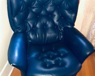 Blue vinyl chair on wheels
