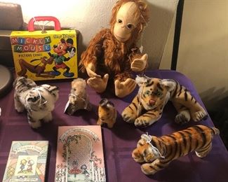Mickey Mouse picture cubes, Schuco “Tricky” Yes/No monkey, Steiff animals: 2 tigers, small beaver & bunny & tabby cat, Joan Walsh Anglund books