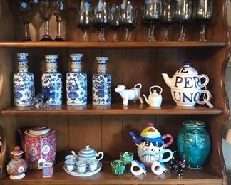 Fostoria goblets, blue & white Asian bottles, red Chinese teapot & cruet, Chinese "rice eye" mini blue & white tea set, Chaleur cat teapot, pottery vase with dragonfly