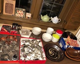 Many cookie cutters, pottery pie pan, wooden salad sets & more