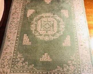 Pale green Chinese wool rug (50” x 78”)