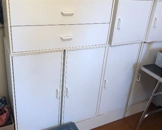 Lots of white laminate storage pieces (many more than shown here), clock radios, hats