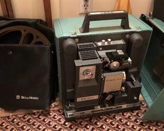 Bell & Howell 1585 16mm movie projector with vinyl cover/reel holder
