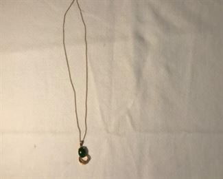 Gold and jade pendant on gold chain