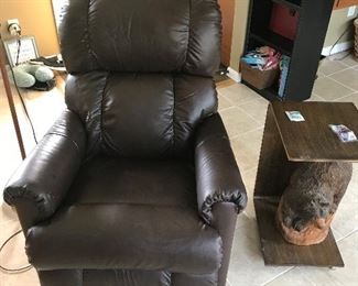 Recliner chair and carved bear