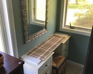 Small desk, wicker seat and framed mirror