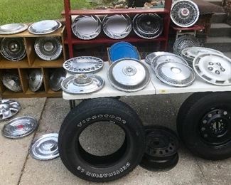 Goodyear Assurance all season tire(P215-70-r15) w rim aired up excellent tread. Firestone P235-70-r16 all season tire good tread. set of 4 1940s Blue Ford hub covers, set of 4 Chevy wheel covers, 26 other various vintage Aluminum/stainless wheel covers....