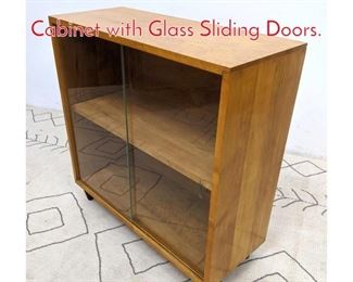 Lot 1133 PAUL MCCOBB Bookcase Cabinet with Glass Sliding Doors.