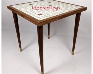 Lot 1469 Masaic top table with tapered legs.