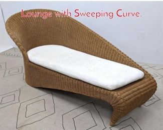 Lot 1207 Designer Rattan Chaise Lounge with Sweeping Curve. 