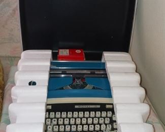 Vintage Blue Royal Typewriter.....looks to never have been used. Still has Styrofoam. $100.00
