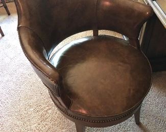 LEATHER SWIVEL CHAIR TRIMMED IN NAILHEAD