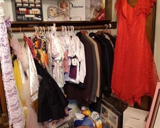 This "doll room" closet contains vintage coats, sequined dance costumes and new with tags baby clothing,  and vintage hook rug kits.