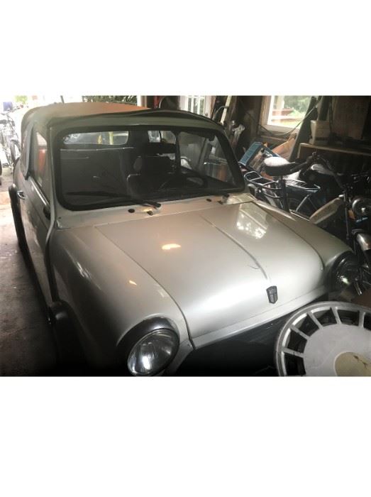  RARE!! 1977 Morris Mini Factory Convertible. 57 K original miles.  4 Speed Trans. White paint, new white top, red leather interior.  Left side drive.  Been in garage storage for 10 years.  Historical Plates.  Great fun collectible