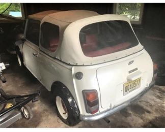  RARE!! 1977 Morris Mini Factory Convertible. 57 K original miles.  4 Speed Trans. White paint, new white top, red leather interior.  Left side drive.  Been in garage storage for 10 years.  Historical Plates.  Great fun collectible