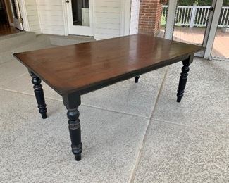 Harvest table. Stained wood top with turned legs. 