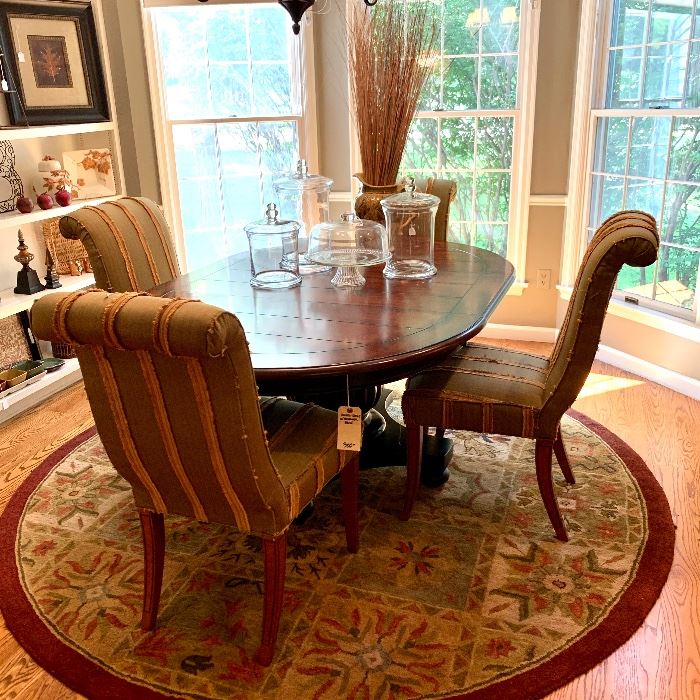 $550-Beautiful round table with one leaf and pedestal base. Table measures 48”d x 30”h. Leaf is 20” x 48”. More images of this available - keep scrolling through! 