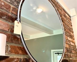 $60. Modern, low profile round mirror with a satin finish rim. Hangs with a wire. Heavy! Measures 31”d.