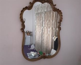 Carved wood framed wall mirror