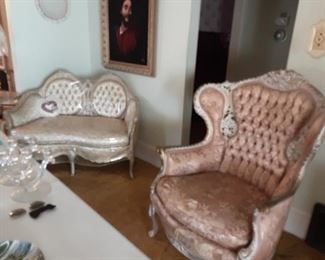Italian style antique white love seat and pink side chair.