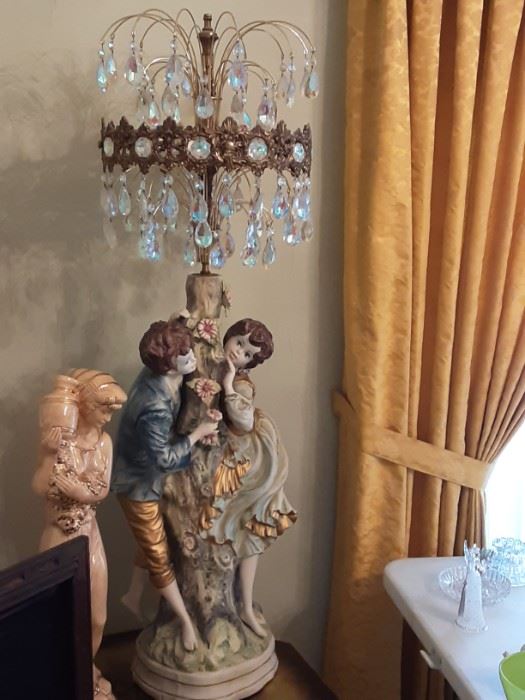 Full view of Double Figure (Boy & Girl) Capodimonte Table Lamp with Crystal prism Shade.  Women with vase Ceramic statue.