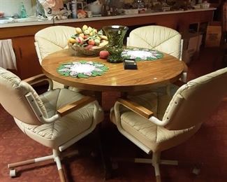 1960s Round Formica Table with 4 Puffy Leather Swivel Chairs on Rollers Set