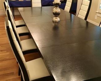 Huge Ebony dining table with 12 ebony and white leather dining chairs