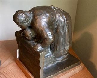 Vintage Alva Museum - Mother comforts child statue 