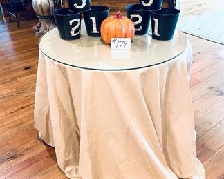 Glass top table with skirt 30”w x 28” t $50
Set of Tins (3) $12 each
Pumpkin candle 5”t $5