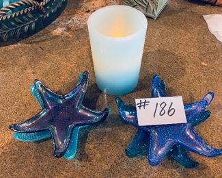 Four-star coasters and aqua candle 6 inches tall $12