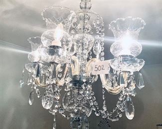 Cut glass five arm  chandelier with globes and drops 
22 inches wide by 26 inches long $800