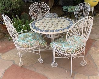 1960s MCM Wrought Iron Peacock Patio set Tile top table w/ 4 Chairs Table: 26.5in H x 35.5 diameter. Chairs:39.5x 22x20 in HxWxD