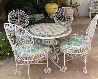 1960s MCM Wrought Iron Peacock Patio set Tile top table w/ 4 Chairs Table: 26.5in H x 35.5 diameter. Chairs:39.5x 22x20 in HxWxD