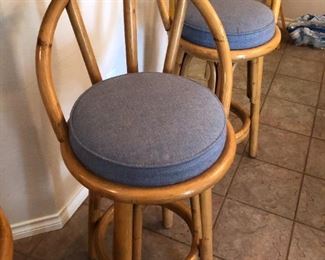 2 rattan swivel bar stools