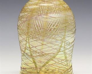 An Early 20th century Steuben Glass Shade.  Calcite and Gold Aurene glass with pulled feather motif and applied threaded design about the exterior.  Shape number 2259.  Unmarked,  some losses to threading.  3 1/2 x 5 1/4" high, fitter 2 1/4". 