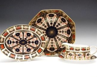 Three 20th century Royal Crown Derby "Old Imari" pattern fine bone china service items.   Includes an 11" octagon bowl, a 7 3/4 x 10" oval bowl and a 7 1/2" sauce boat with oval underplate.  Printed marks with 1128 and XL11, XL1 and XL4 respectively.  Appears unused, no apparent wear or damage.  ESTIMATE $800-1,200