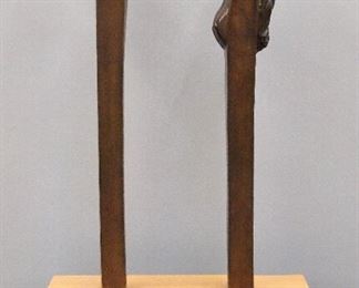 Victor Salmones, Mexican, 1937-1989.  Bronze figure entitled "Images" depicts a man  and woman head looking upward.  Signed "108  V. Salmones  P/A" at back of each.  Medium Brown patina with slight wear.  In two parts approx 6 x 5 1/2 x 27" high on a custom Figured Maple base  19 3/4 x 9 3/4 x 5 1/4" high.  ESTIMATE $1,000-2,000