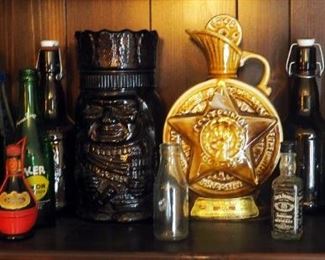 Collectible Glass Beer Bottles, Native American Glass Canister, Ceramic Jim Beam Centennial Decanter, And More
