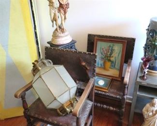 Spanish/Gothic leather and wood armchairs, lanterns and a beautifully painted folding screen