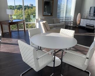 Enjoy your morning coffee or breakfast sitting at this fabulous white pedestal kitchen table with 4 upholstered arm chairs. Chairs provide wonderful support and ease of getting up. Table dimensions are 48"W X 30" (Picture 1 of 3). Sale Price $2,000