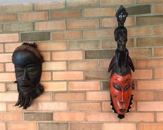 Many vintage masks from numerous countries, two shown here.