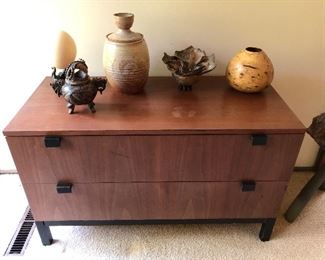 Modern two-drawer chest; antique Chinese soapstone censer (front left).
