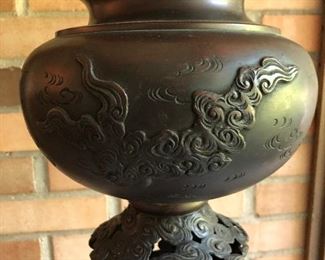 Close-up of upper section of Japanese bronze temple lantern.