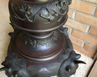 Close-up of lower section of Japanese bronze temple lantern.