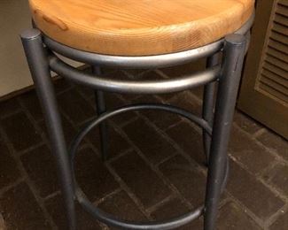 Metal stool with wood seat.